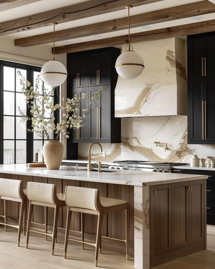 a large kitchen with marble counter tops and black cabinets, along with wooden flooring