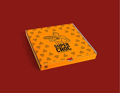 an orange box with the title super croc on it sitting on a red surface