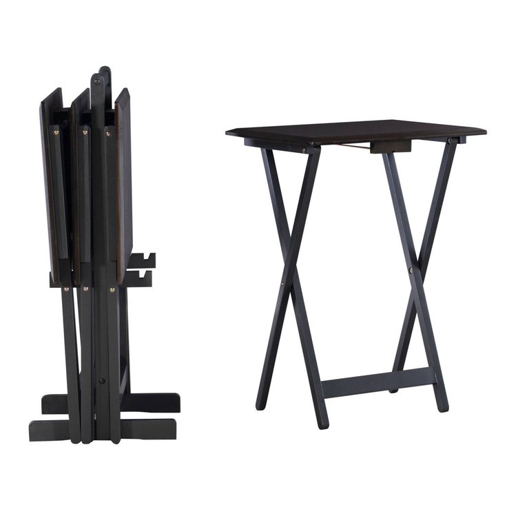 a black table with two folding chairs next to it