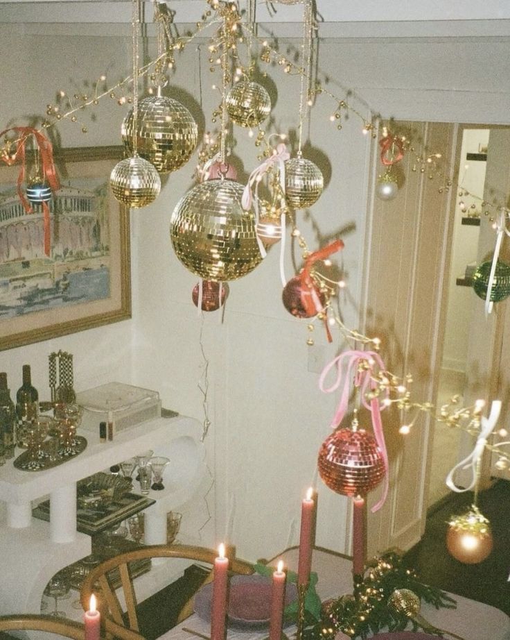 a dining room filled with lots of christmas decorations and candles on top of a table