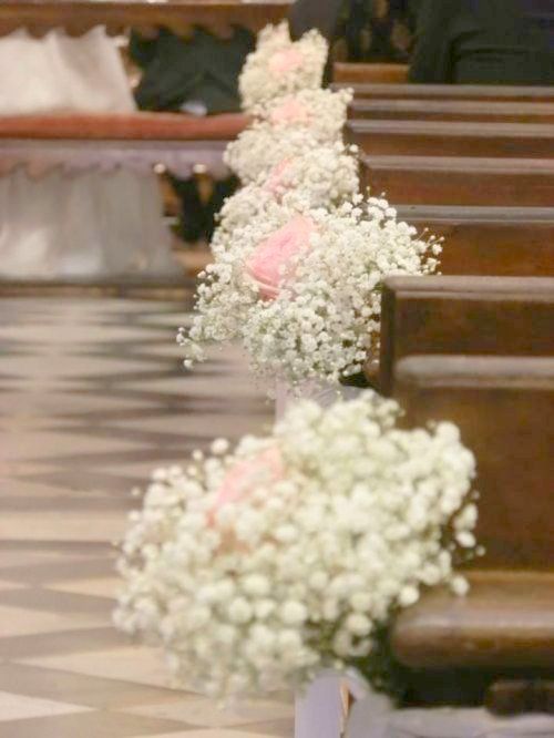 flowers are placed on the pews at a wedding