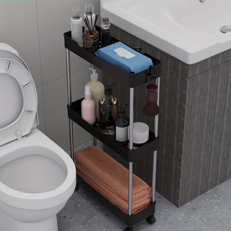 a bathroom with a toilet, sink and shelving unit