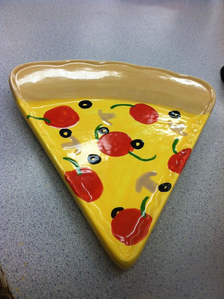 a slice of pizza sitting on top of a counter