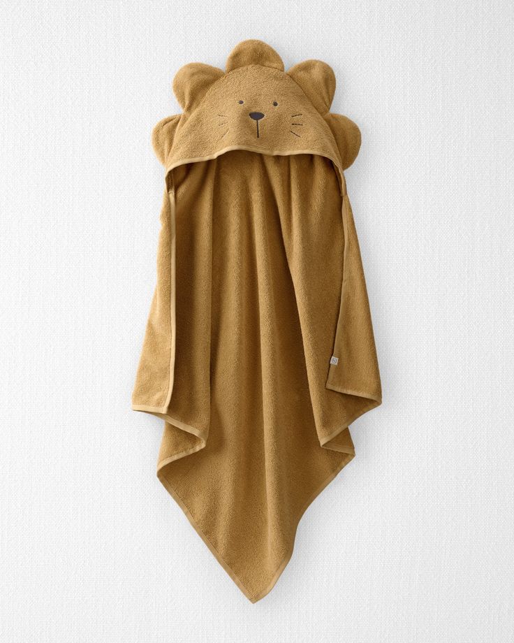 a teddy bear towel hanging on the wall with it's hood pulled up to reveal its face