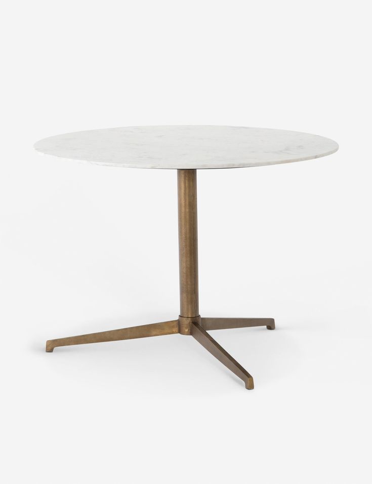 a white table with gold legs and a round marble top, on a white background