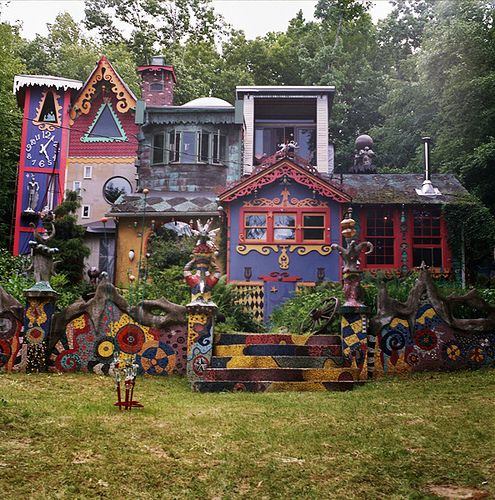 an elaborately decorated house in the woods