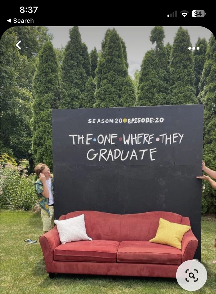 two people standing in front of a blackboard with the words the one where they graduate