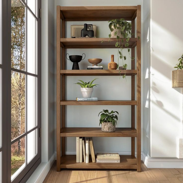 a wooden shelf filled with lots of books next to a window and potted plants