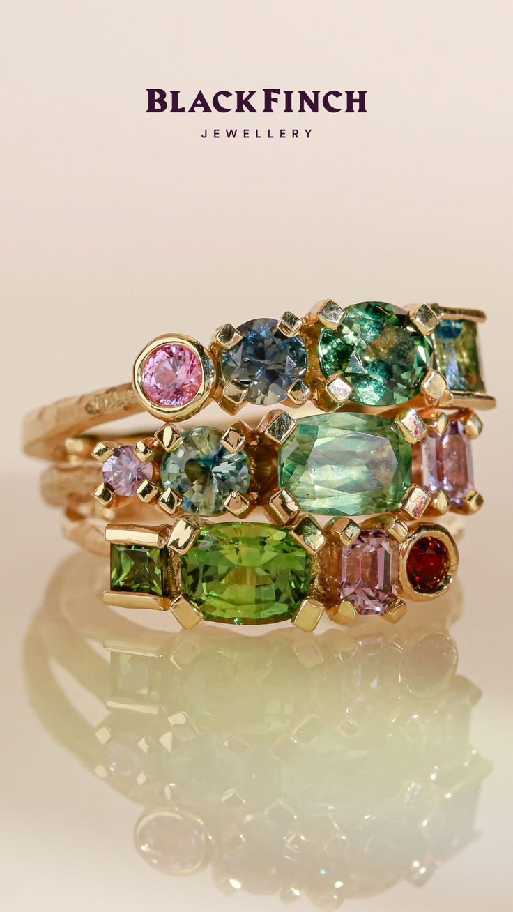 Three colourful gemstone rings stacked on top of each other featuring hues of pink, blue, green and red. Ring Bracelet Chain, Sapphire Rings, Sparkly Things, Wax Casting, Lost Wax Casting, Fine Jewellery Earrings, Lost Wax, Gift Vouchers, Welcome To The World