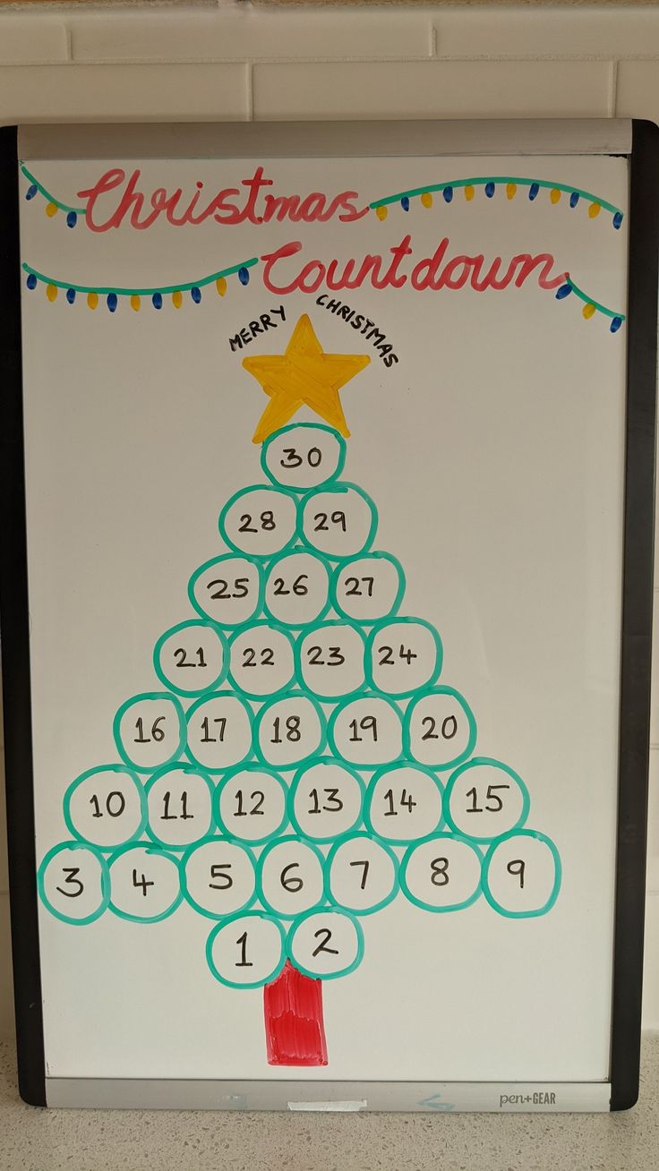 a christmas tree made out of numbers on a white board