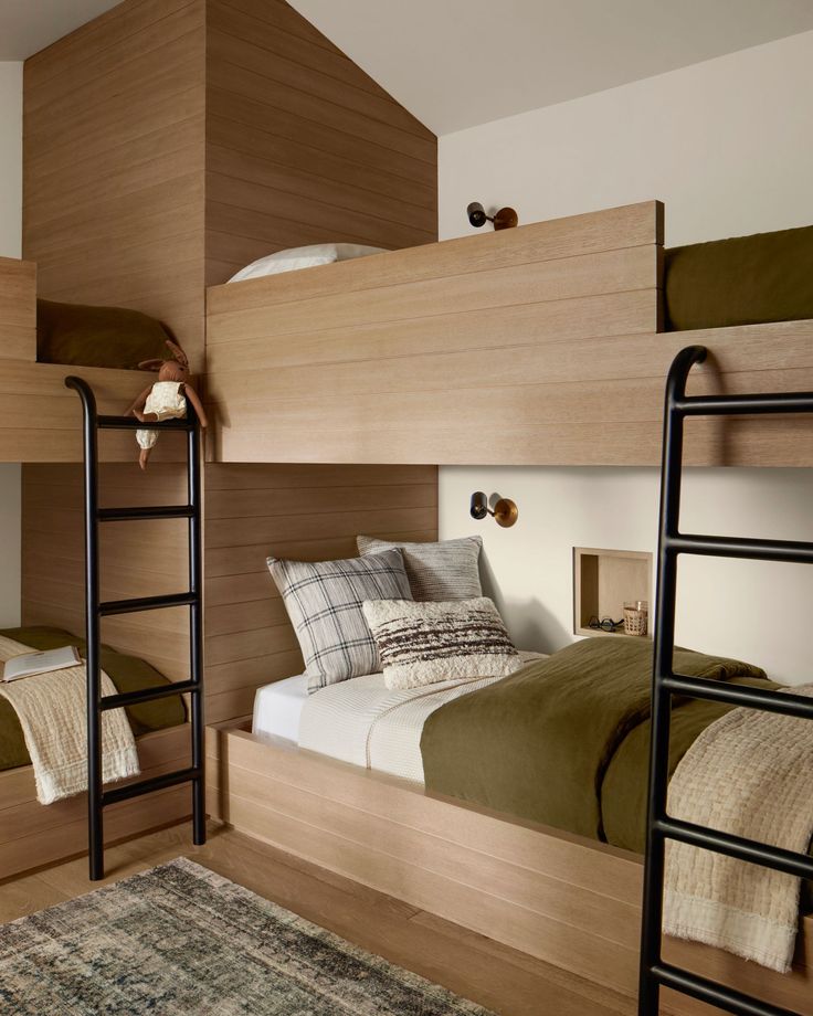 the bunk beds are made up and ready for someone to use them in their home