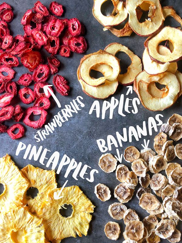 various dried fruits are displayed on a blackboard with the words homemade dried fruits written in white