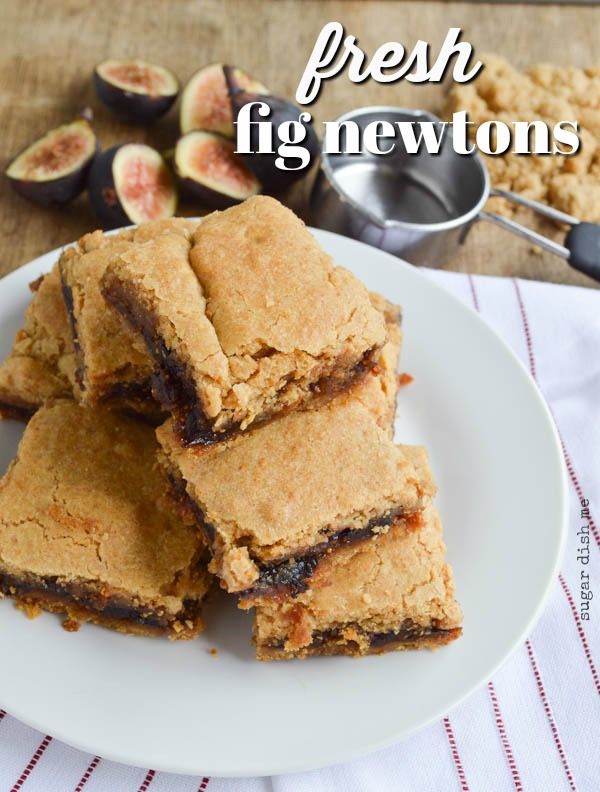 fresh fig newtons on a white plate next to some sliced figs