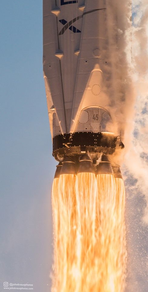 the space shuttle is flying through the air with it's landing gear on fire