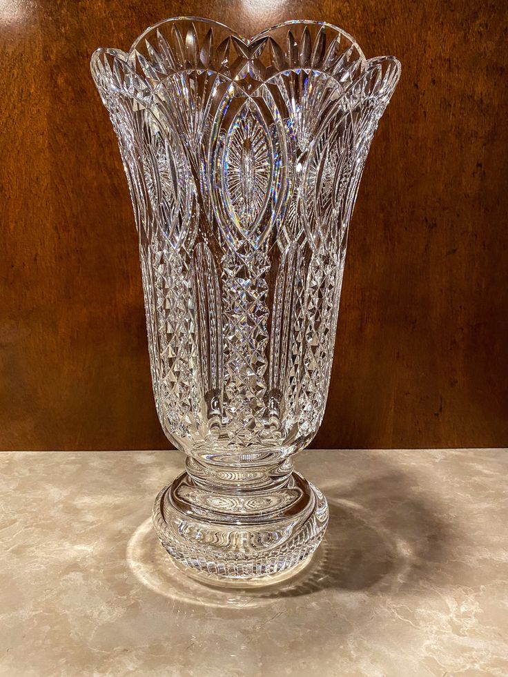 a clear glass vase sitting on top of a table