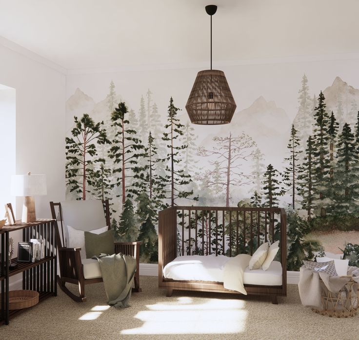 a baby's room decorated with pine trees, mountains and forest murals on the wall