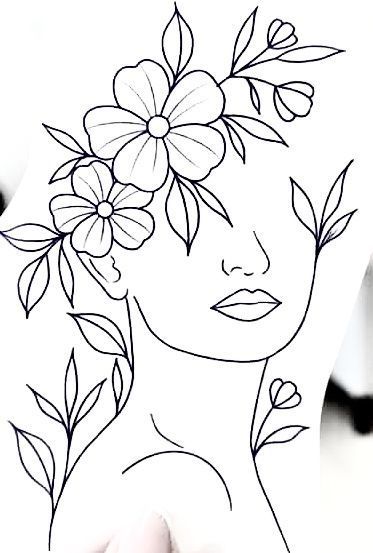 a woman's face with flowers in her hair, drawn on paper by hand