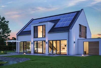 a modern house with solar panels on the roof