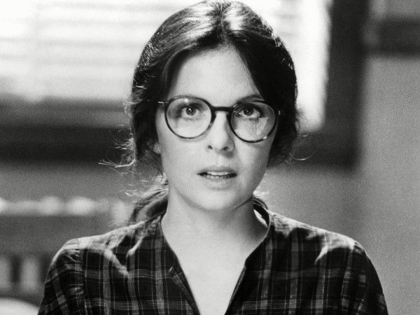 black and white photo of a woman wearing glasses