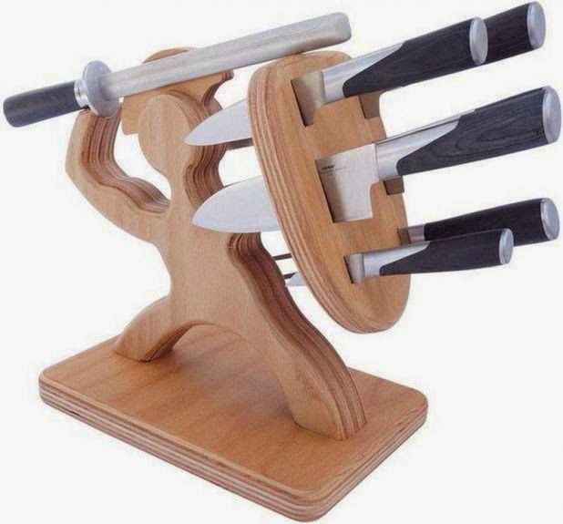 a wooden knife holder with six knives on it's sides and four knives in the middle