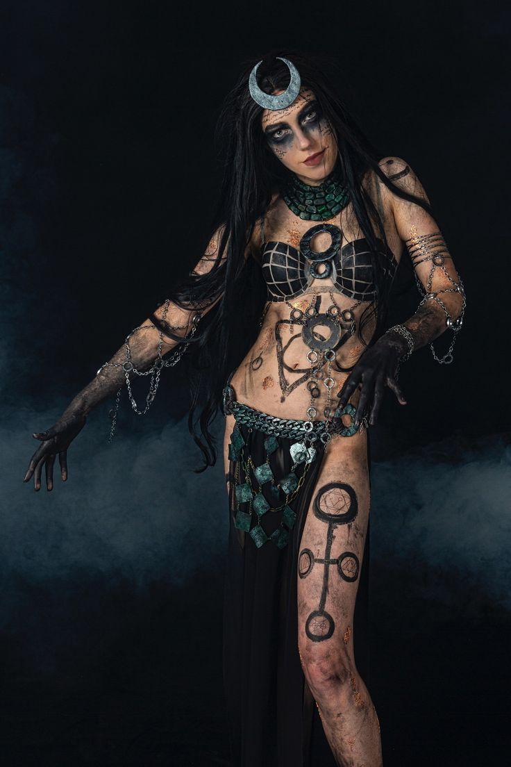 a woman with tattoos and piercings on her body