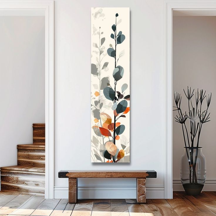 a painting hanging on the wall next to a wooden bench in a room with white walls