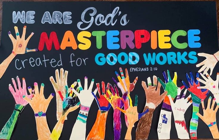 a sign that says we are god's masterpiece created for good works with hands painted on it