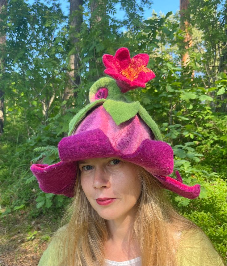 Beautiful pink and purple  bell flower hat with rolled stem Pixie hat, Winter hat, Fairy hat, Theater hat, felt wool hat Unique hat in which you will feel amazingly good. It is from natural material and created with love. Warmth, coziness, pleasure and festive feeling will embrace you. Good mood is guaranteed. A good gift for a good person. Hat has a wide usage: it can be a sauna hat, an everyday hat, or a hat for a special occasion. As a sauna hat it will protect your head and hair from the hea Purple Whimsical Winter Hat, Whimsical Purple Winter Hat, Adjustable Whimsical Felt Hat, Whimsical Fitted Brimmed Hat, Whimsical Pink Flower Hat, Handmade Purple Mini Hats With Curved Brim, Pink Handmade Flower Hat, Handmade Pink Flower Hat, Pink Flower-shaped Handmade Hats