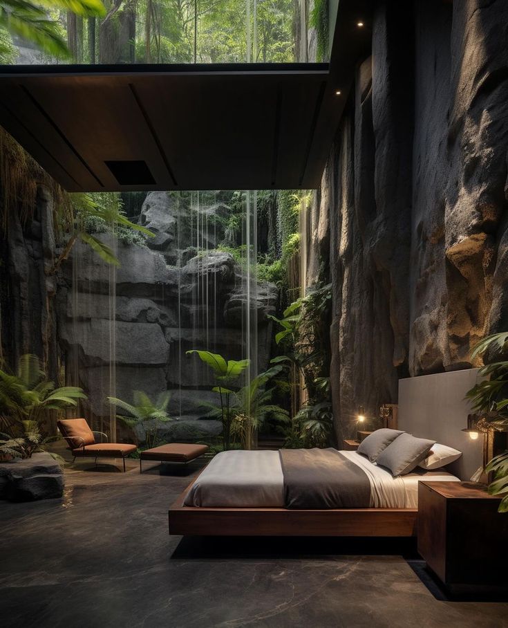 a bedroom with a waterfall in the background