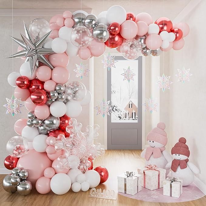 a balloon arch is decorated with pink, silver and white balloons