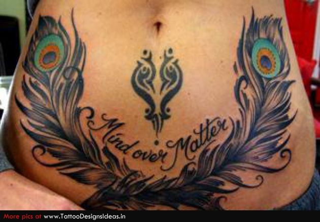 a woman's stomach with peacock feathers and the words mad over mother written on it