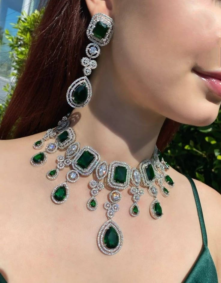 Make an entrance in this stunning emerald green and diamondesque necklace and earrings set featuring lab simulated emeralds and AAA Quality white Cz that sparkle like diamonds. Platinum plated. The Necklace Has adjustable Chain The Earrings Have Pushbacks Earrings measure 3 inches Aprox Highest quality and craftsmanship. Please let me know if you have any questions Customized orders takes 3 to 4 weeks, depending on piece requirements. The Ombre Designs Jewelry pieces can be customized in accorda Emerald Sets Jewellery Gold, Emerald Green Bridal Jewelry, Green Diamond Necklace Set, Emerald Green Necklace Set, Luxury Statement Green Emerald Necklace, Emerald Jewelry Necklace Vintage, Emerald Green Indian Jewelry, Emerald Jewelry Necklace Gold, Emerald Jewellery Set