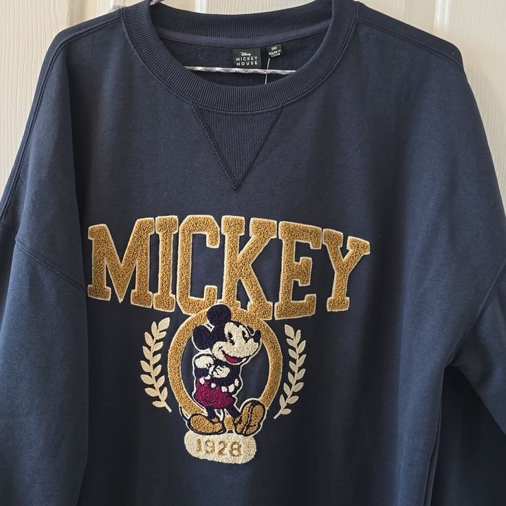 Disney Mickey Mouse Signature Women's Junior Blue Oversized With "Mickey 1928" Embroidered On The Sweatshirt, Size Small. How Cute Is This Sweatshirt?? New With Tags Never Worn. Smoke-Free Home. Please Bundle And Save!! Bin 257 Bag *Small Imperfection On The Right Sleeve As Shown In The Picture.* Mickey Sweatshirt, Mickey Mouse Sweatshirt, Disney Sweatshirts, Blue Hoodie, Disney Tops, Distressed Black Jeans, Vintage Disney, Disney Mickey Mouse, Zip Sweatshirt