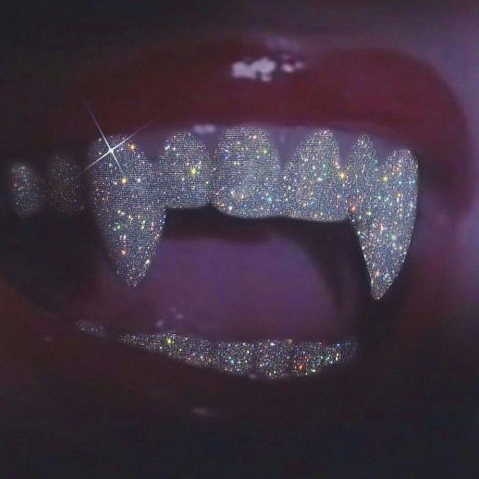 a person's mouth with glitter on it