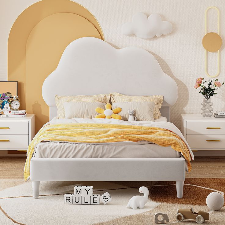 a white bed sitting in a bedroom next to a wall mounted clock with clouds above it