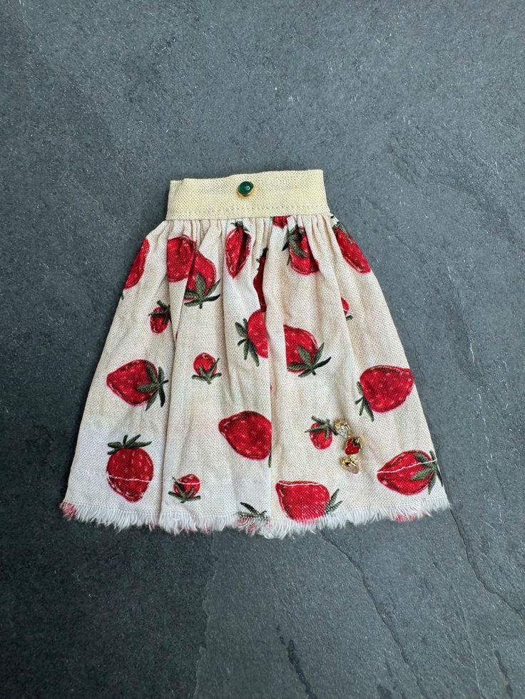 Perfect for Blythe or other sized dolls. Made of 100% cotton, this skirt features frayed edged on a cute strawberry print with 3 small strawberry buttons and a green button.  I hand wash all of my clothing, but I don't recommend keeping dark clothing on your doll for long, it may cause color transfer.  I try to make my clothing fit most body types, but if you have any questions, don't hesitate to reach out.  Thanks for looking. Strawberry Skirt, Strawberry Clothes, Dark Clothing, Dark Outfits, Cute Strawberry, Strawberry Print, Green Button, Doll Clothing, Print Skirt