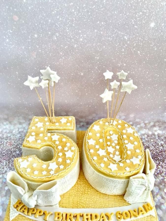 a 50th birthday cake with stars on it