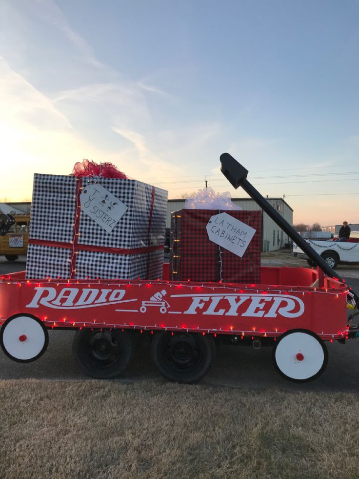 a red radio flyer wagon with christmas presents on it