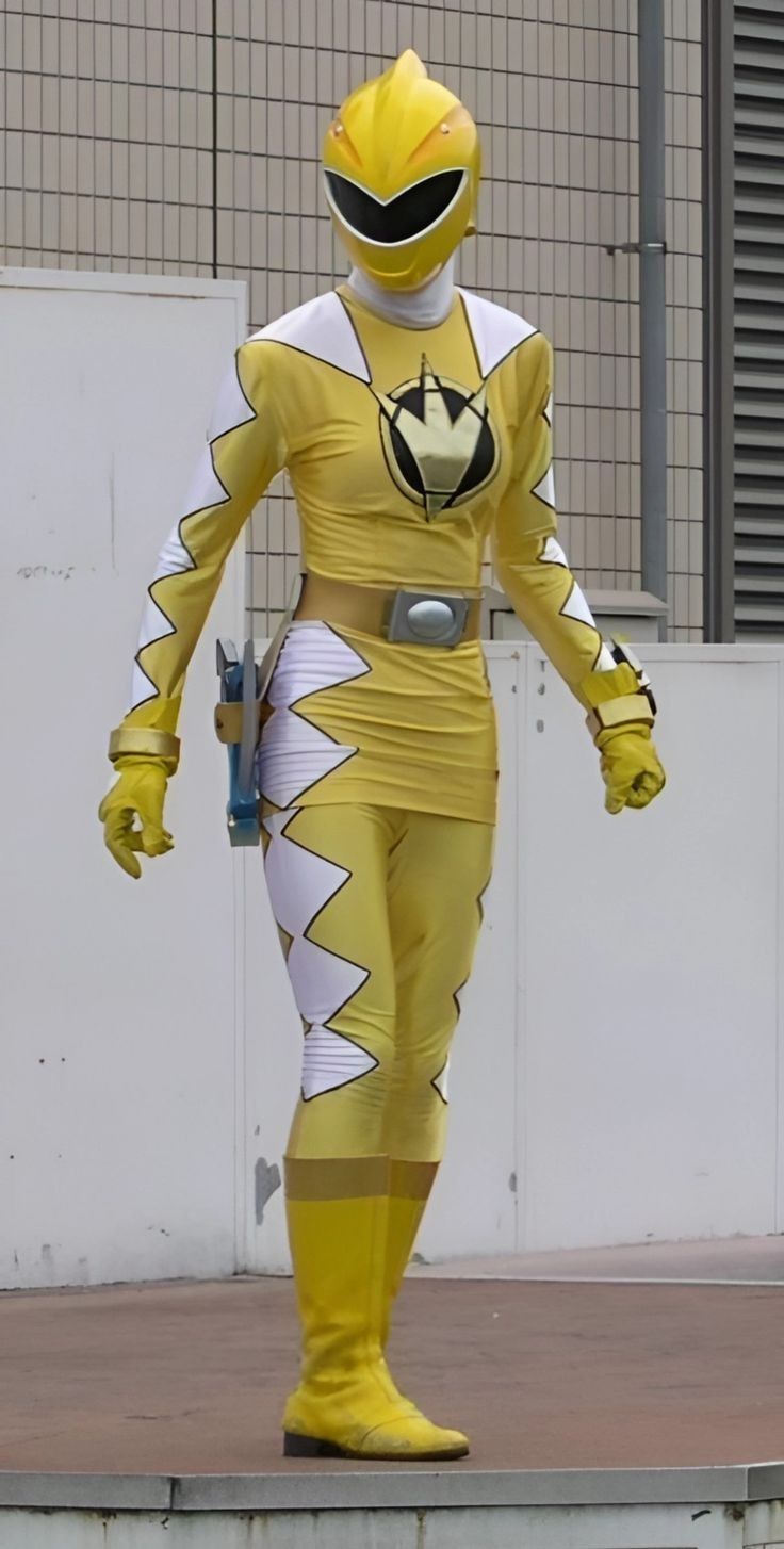 a man in a yellow and white costume