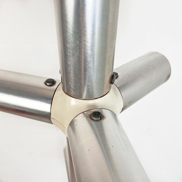 a close up of a metal object on a white surface