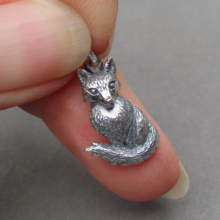 A sterling silver fox necklace pendant charm.  The finished dangle measures 22mm x 12mm (25mm = 1 inch) with a 6mm open jump ring. MORE Sterling Silver Charms: https://www.etsy.com/shop/TheDangleDiva?ref=seller-platform-mcnav&section_id=12085195 MORE Charms, Dangles and Pendants: http://www.thedanglediva.etsy.com FOLLOW me: www.facebook.com/thedanglediva for new designs and discount coupons INTERCHANGEABLE EARRINGS: https://www.etsy.com/shop/TheDangleDiva?ref=hdr_shop_menu&section_id=20069837 NE Fox Necklace, Interchangeable Earrings, Fox Jewelry, Foxes Necklace, Luck Charm, Luck Charms, Silver Fox, Necklace Charm, Wild Animal