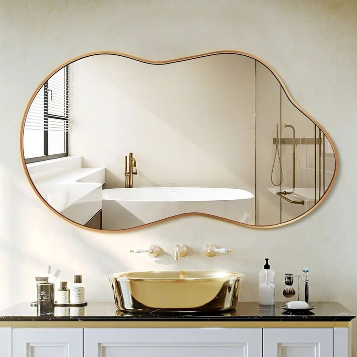 a bathroom with a sink, mirror and bathtub on the wall in it's corner