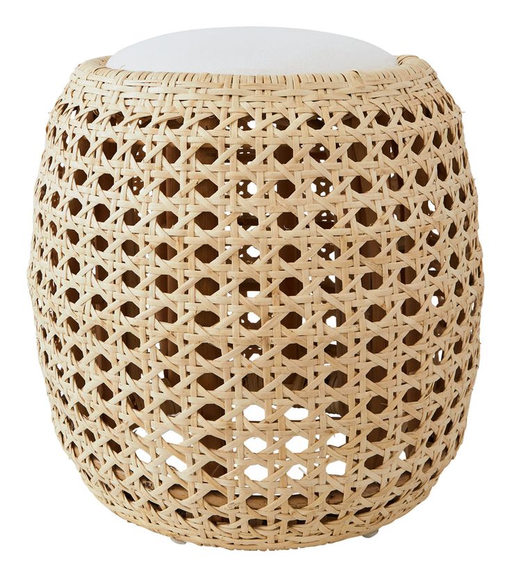 the stool is made out of wicker and has a white seat cushion on it