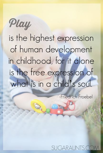 a baby laying on the ground with a toy in his hands and a quote about play