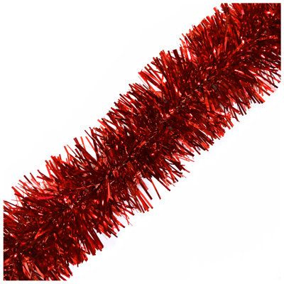 a red tinsel christmas tree on a white background