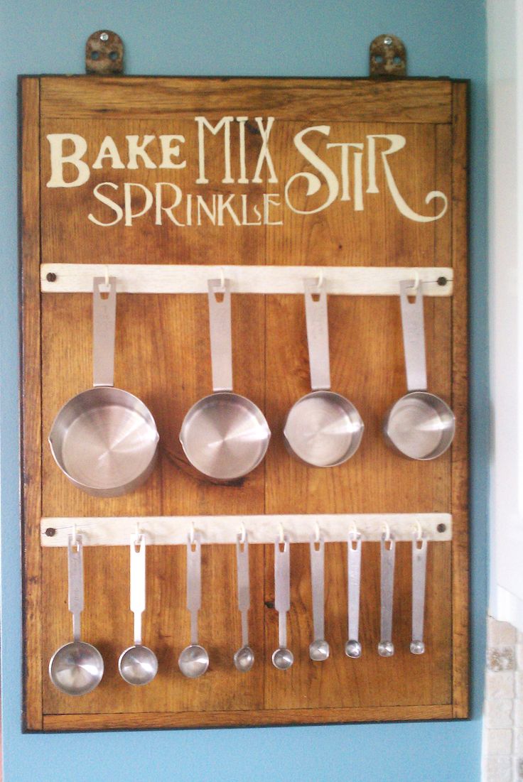 a wooden sign that says bake mix stir sprinkles with spoons on it