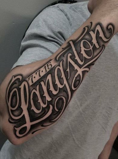 a man with a tattoo on his arm that says,'congratulations'in cursive