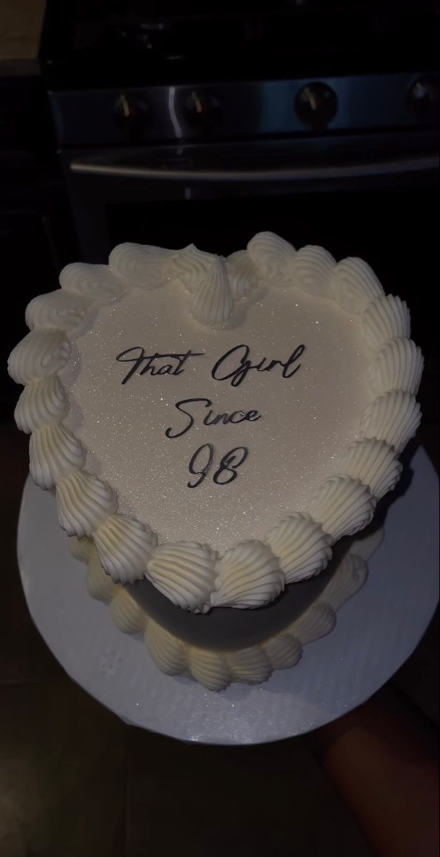 a heart - shaped cake with the words first aid written on it in white frosting