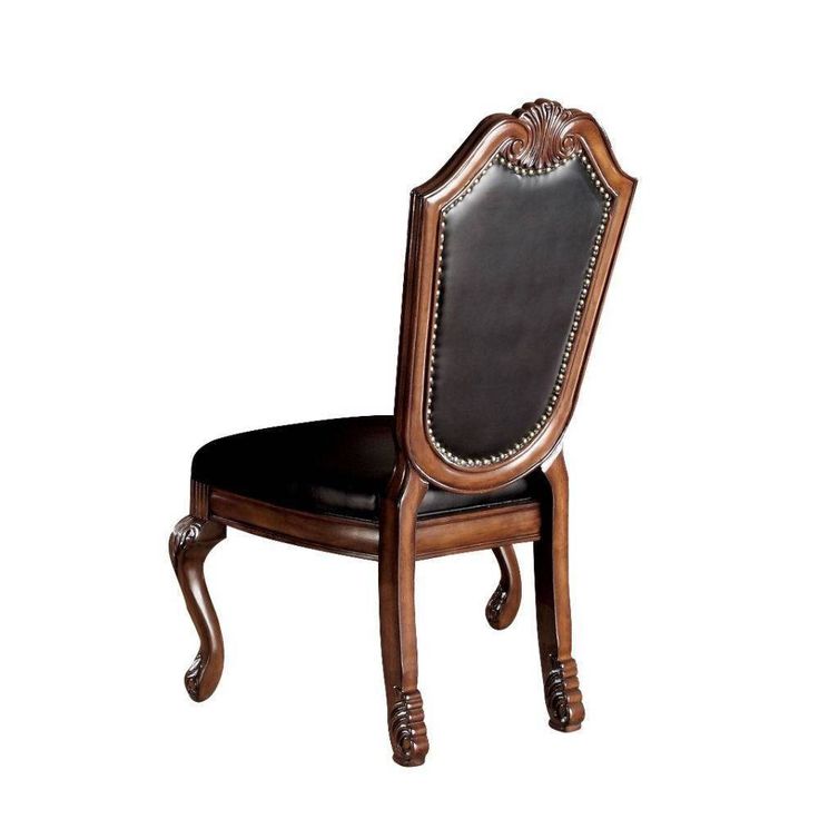 a wooden chair with black leather upholstered seat