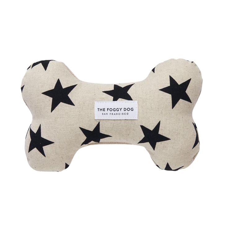 the doggy dog bone with stars on it's side is shown in black and white